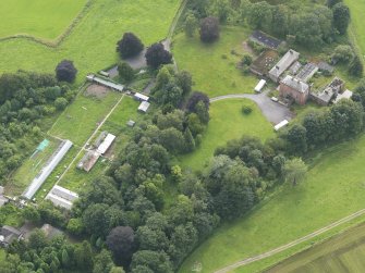 Oblique aerial view of Carnsalloch House and walled garden, taken from the NE.