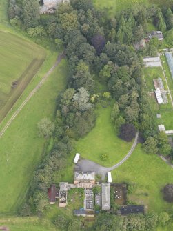 Oblique aerial view of Carnsalloch House and walled garden, taken from the WSW.