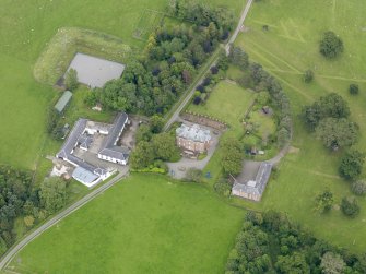 Oblique aerial view of Tinwald House and policies, taken from the SW.