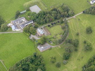 Oblique aerial view of Tinwald House and policies, taken from the SSE.