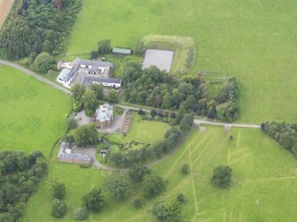 Oblique aerial view of Tinwald House and policies, taken from the SE.