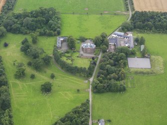 General oblique aerial view of Tinwald House and policies, taken from the NE.