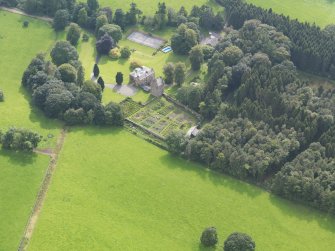 Oblique aerial view of Amisfield House and policies, taken from the NE.