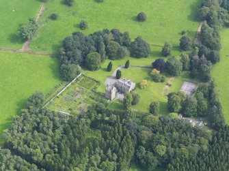 Oblique aerial view of Amisfield House and policies, taken from the NW.