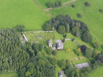 Oblique aerial view of Amisfield House and policies, taken from the W.