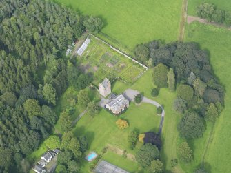 Oblique aerial view of Amisfield House and policies, taken from the SW.