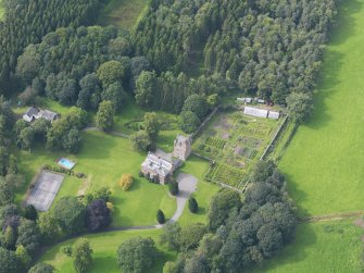 Oblique aerial view of Amisfield House and policies, taken from the SE.