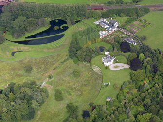 General oblique aerial view of Portrack House and gardens, taken from the SW.