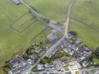 Oblique aerial view of Dunscore Parish Church, taken from the NE.