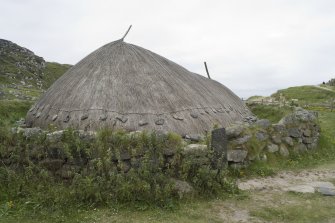 View of reconstructed Iron Age house at Bosta, taken from SSE