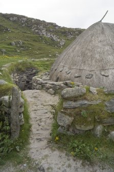 Detail of entrance pathway leading down into the enclosure of the reconstructed Iron Age house