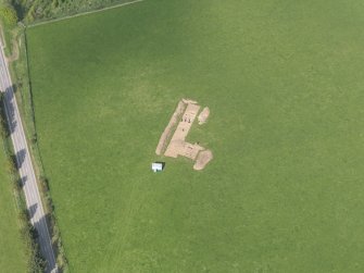 Oblique aerial view centred on the excavation of the enclosures at Barflat, Rhynie, taken from the SSW.