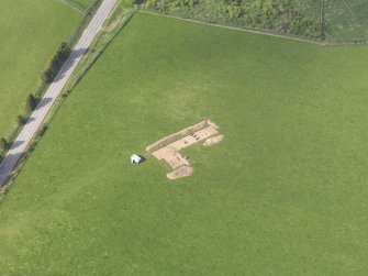 Oblique aerial view centred on the excavation of the enclosures at Barflat, Rhynie, taken from the S.