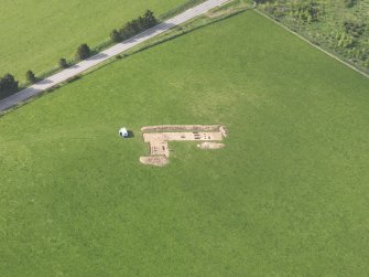 Oblique aerial view centred on the excavation of the enclosures at Barflat, Rhynie, taken from the SE.