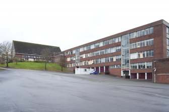 Main classroom block and assembly hall, view from NE