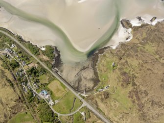 Oblique aerial view of Morar centred on the remains of the fish trap, taken from the NE.