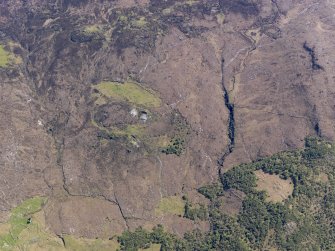 Oblique aerial view of the remains of the townships of Kilchrist and Strath Suardal, showing the remains of nearby enclosures, head dykes, rig and furrow and the remains of a disused marble quarry, Strath Suardal, Skye, taken from the N.