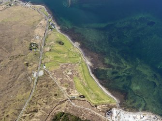 Oblique aerial view of the remains of fish traps near Sconser golf course, and the remains of Achadh Mor township, field system and lazy beds extending towards Sconser, Skye, taken from the SE.
