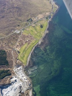 General oblique aerial view of the remains of fish traps near Sconser golf course and quarry, and the remains of Achadh Mor township, field system and lazy beds, Skye, taken from the E.