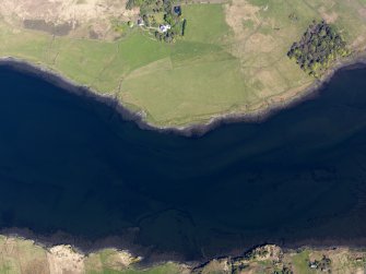 Oblique aerial view of the remains of the fish traps and kelp grids in Loch Snizort, taken from the W.