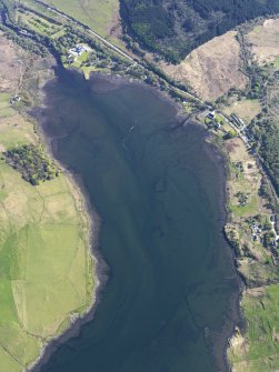 General oblique aerial view looking up Loch Snizort towards the Skeabost Hotel with the remains of the fish traps and kelp grids in the foreground, taken from the N.