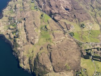 Oblique aerial view of the remains of the township, field system, head dykes and lazy beds, at Treaslane, Skye, taken from the N.