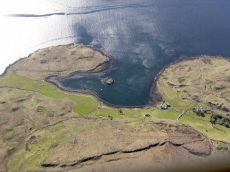 General oblique aerial view of the remains of the fort at Dun Maraig and the remains of the township, field system, enclosures and lazy beds at Cuidrach, Skye, taken from the E.