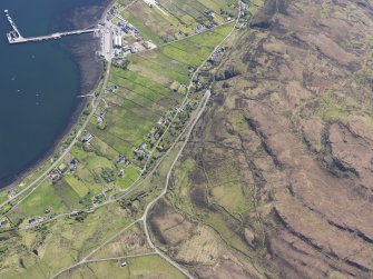 Obligue aerial view of King Edward Pier, the township of Idrigil and the nearby  remains of a field system and lazy beds around Creag Liath, Uig, Isle of Skye, taken from the NNE.