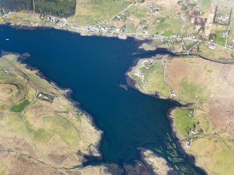 Oblique aerial view of the remains of a series of fish traps around the head of Loch Dunvegan near Kilmuir, Isle of Skye, taken from the SW.