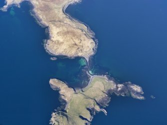 Oblique aerial view of the remains of a fish trap at Oronsay, and the nearby cultivation remains on Oronsay and at Ullinish, Isle of Skye, taken from the SW.