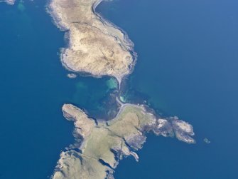 Oblique aerial view of the remains of a fish trap at Oronsay, and the nearby cultivation remains on Oronsay and at Ullinish, Isle of Skye, taken from the SW.