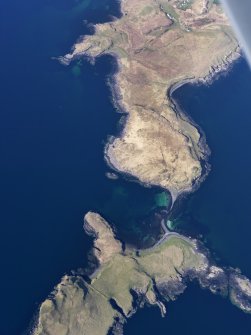 Oblique aerial view of the remains of a fish trap at Oronsay, and the nearby cultivation remains on Oronsay and at Ullinish, Isle of Skye, taken from the SW.