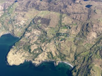 Oblique aerial view of the remains of the townships, field systems and lazy beds at Fiskavaig, Isle of Skye, taken from the NW.