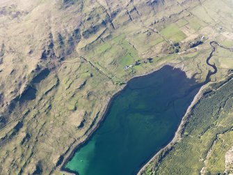 Oblique aerial view of the remains of the townships of Faolainn and Cnoc Loisgte and the remains of a series of fishtraps at the head of Loch Eynort, Isle of Skye, taken from the SE.