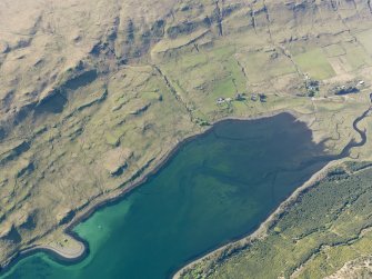 Oblique aerial view of the remains of the townships of Faolainn and Cnoc Loisgte and the remains of a series of fishtraps at the head of Loch Eynort, Isle of Skye, taken from the SE.