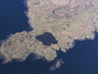 Oblique aerial view of the remains of the township, harbour and cultivation remains at Rubh' an Dunain, Isle of Skye, taken from the S.