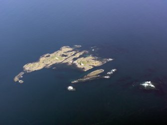 General oblique aerial view of Oigh-Skeir and the Hyskier lighthouse, taken from the NW.