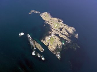 Oblique aerial view of Oigh-Skeir and the Hyskier lighthouse, taken from the SW.