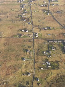 Oblique aerial view of the buildings at Arnol, taken from the W.