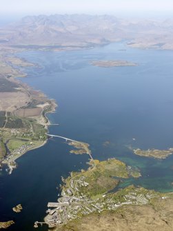 General oblique aerial view of the Skye Bridge with Kyle of Lochalsh in the foreground and the Cuillin Hills in the distance, taken from the S.