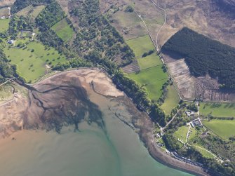 Oblique aerial view centred on the remains of the fish traps, taken from the W.