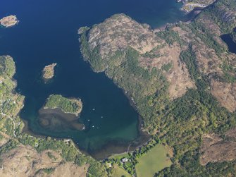 Oblique aerial view centred on the remains of the fish trap with Shieldig Lodge Hotel adjacent, taken from the S.