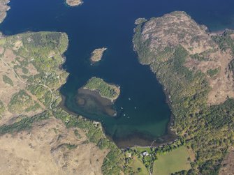 Oblique aerial view centred on the remains of the fish trap with Shieldig Lodge Hotel adjacent, taken from the SSE.