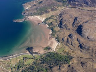 Oblique aerial view looking along the beach at the south end of Gruinard Bay, taken from the SW.