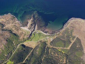 Oblique aerial view centred on the bay at Gruinard House and the remains of the fish trap, taken from the SE.