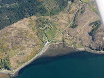 Oblique aerial view of the bay at Reraig centred on the remains of the fish trap, taken from the SW.