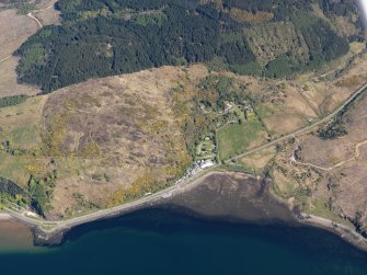 Oblique aerial view of the bay at Reraig centred on the remains of the fish trap, taken from the SSW.