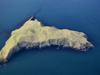 Oblique aerial view of the Shiant Islands, Eilean Mhuire, and the remains of the buildings, huts, lazy beds and field boundaries,taken from the E.