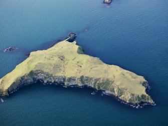 Oblique aerial view of the Shiant Islands, Eilean Mhuire, and the remains of the buildings, huts, lazy beds and field boundaries,taken from the E.