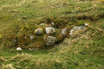 Detail of coursed outer face visible on SE side of builidng.